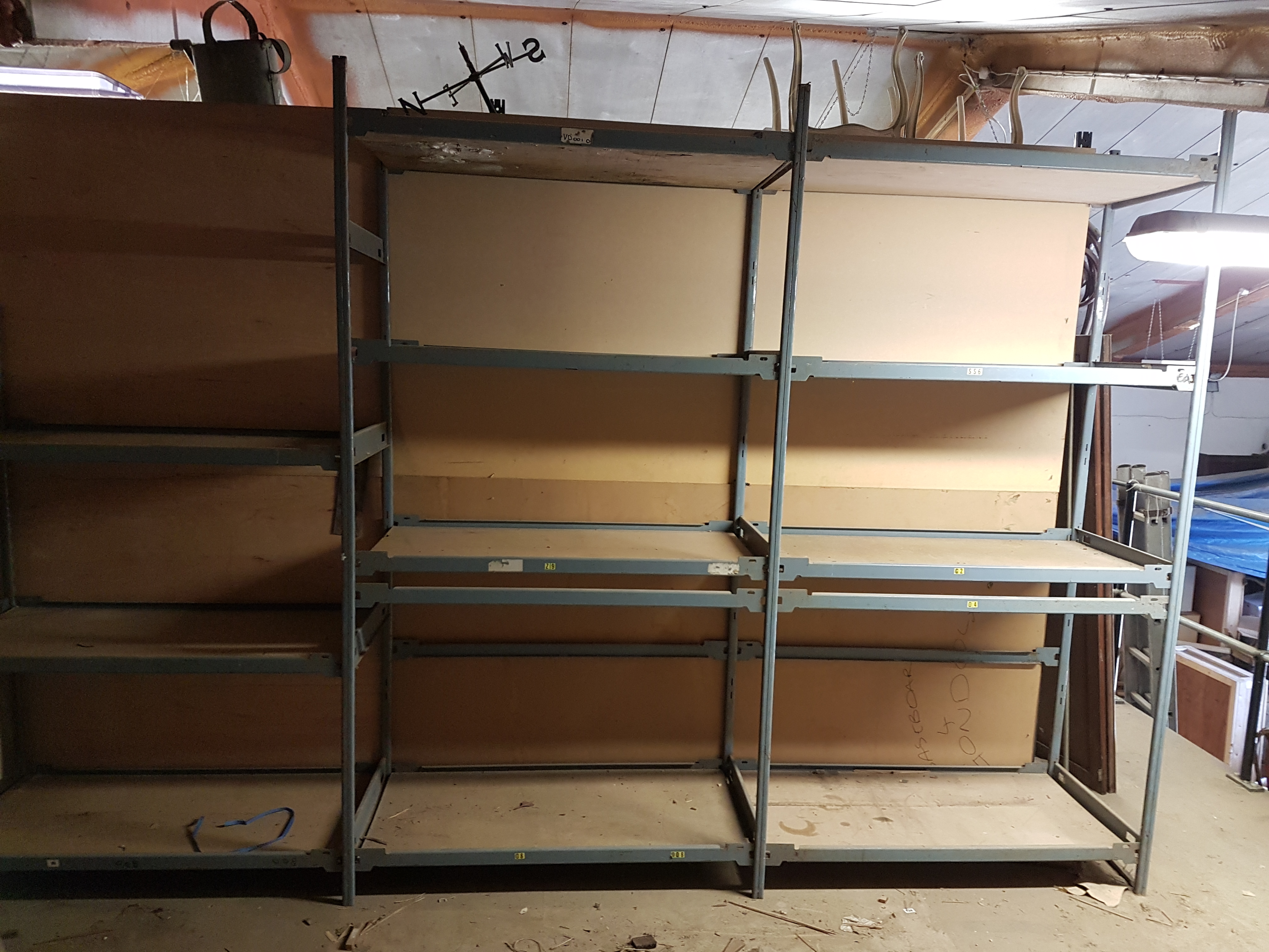 A LARGE SET OF ADJUSTABLE INDUSTRIAL SHELVING.