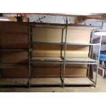 A LARGE SET OF ADJUSTABLE INDUSTRIAL SHELVING.