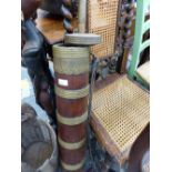 AN INDIAN HARDWOOD AND BRASS CHURN AND A RUSTIC BUCKET