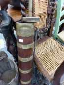 AN INDIAN HARDWOOD AND BRASS CHURN AND A RUSTIC BUCKET