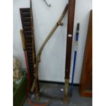 TWO SYTHE, A RAILWAY TRACK LEVER, A CARVED WOOD PANEL AND SHEPHERDS CROOK.