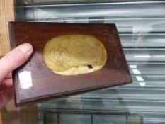 AN ORIENTAL HARDWOOD BOX WITH INSET CARVED JADE PANEL.