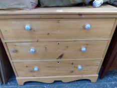 AN ANTIQUE PINE CHEST OF DRAWERS.