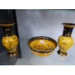 A CARLTON WARE YELLOW GROUND BOWL, AND A MATCHING PAIR OF VASES.