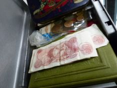 A STRONG BOX OF BRITISH AND OVER COINS TOGETHER WITH AN ALBUM OF PAPER MONEY.