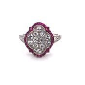 AN ANTIQUE STYLE RUBY, DIAMOND AND WHITE PRECIOUS METAL RING STAMPED PLAT ASSESSED AS 950 PLATINUM.