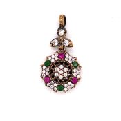 A PRECIOUS WHITE METAL RUBY, EMERALD AND MULTI STONE SET ARTICULATED PENDANT. STAMPED 925 AND