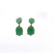 A PAIR OF VINTAGE 9ct YELLOW GOLD AND JADE EARRINGS. THE OVAL JADE IN A 9ct GOLD RUB OVER SET