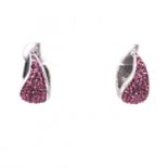 A PAIR OF POLISHED SILVER AND PAVE SET PINK CUBIC ZIRCONIA HINGED HOOPS. DROP 2.2cms. WEIGHT