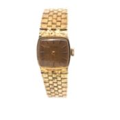 A LADIES GOLD PLATED BULOVA WATCH, ON A BRICK STYLE BRACELET WITH A LADDER CLASP. LENGTH 18cms.