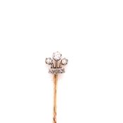 AN ANTIQUE DIAMOND CORONET STICK PIN. THE CORONET MOUNTED IN SILVER AND SET WITH SIX MIXED CUT
