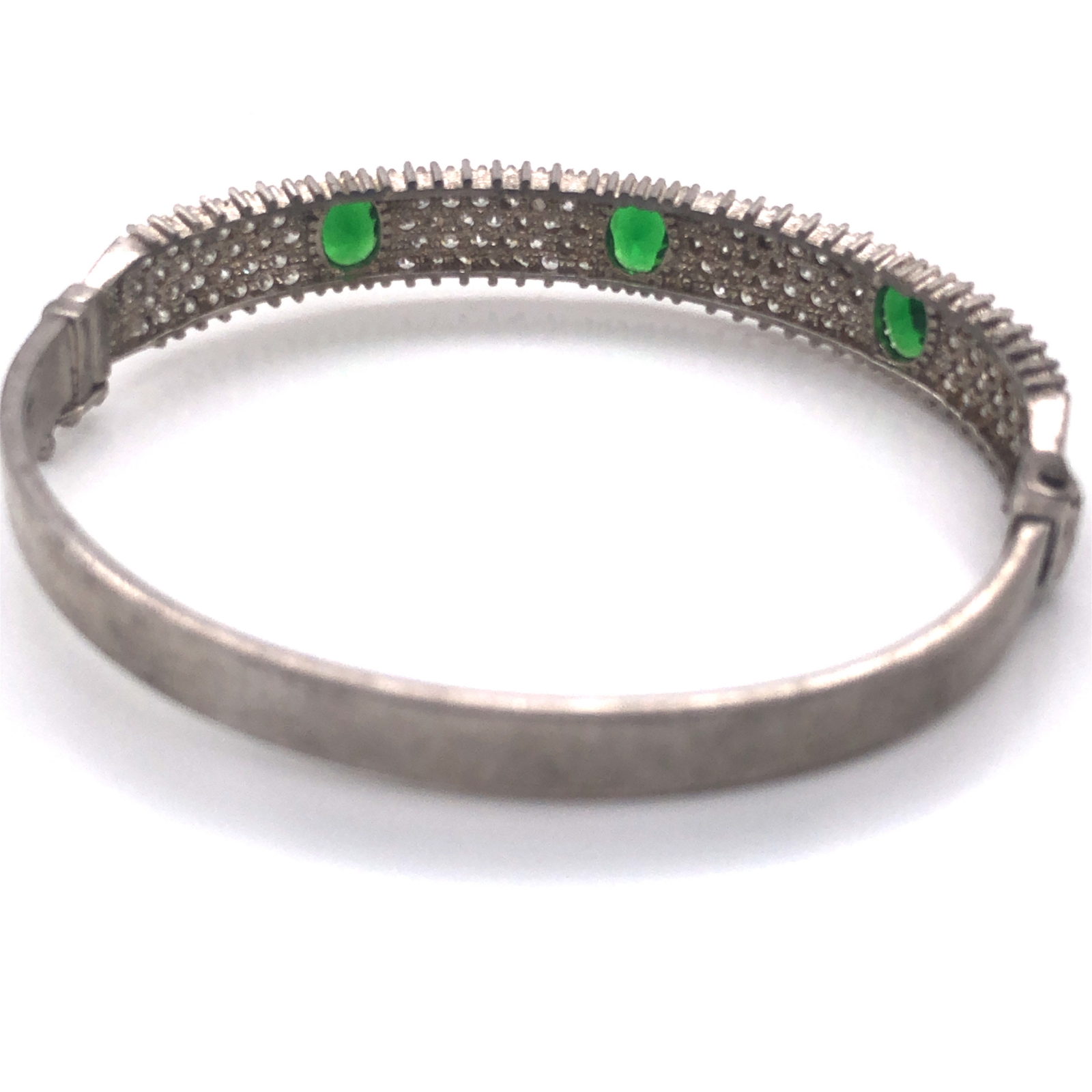 A SILVER AND CUBIC ZIRCONIA SET SPRUNG LOADED HINGED DRESS BANGLE WITH ATTACHED FIGURE OF EIGHT - Image 2 of 3