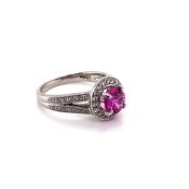 A PINK SAPPHIRE, DIAMOND AND HALLMARKED PLATINUM COCKTAIL RING. THE BRILLIANT CUT PINK SAPPHIRE IN A