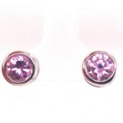 A PAIR OF PINK CUBIC ZIRCONIA RUBOVER SET SILVER STUD EARRINGS. WEIGHT 2.4grms
