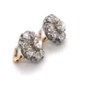 A PAIR OF OLD CUT DIAMOND CLUSTER EARRINGS SET IN PRECIOUS WHITE METAL ASSESSED AT PLATINUM. THE