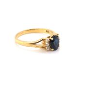 A SAPPHIRE, DIAMOND AND PRECIOUS YELLOW METAL DRESS RING. THE CENTRAL SAPPHIRE IN A RAISED FOUR CLAW