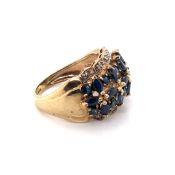 A 9ct HALLMARKED GOLD SAPPHIRE AND DIAMOND MULTI STONE BOMBAY STYLE RING. SET WITH MARQUIS AND