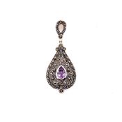 AN AMETHYST, MARCASITE AND SILVER ARTICULATING PENDANT. DROP 4.5cms. WEIGHT 5.3grms.