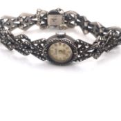 AN EVERITE HALLMARKED SILVER AND MARCASITE LADIES COCKTAIL WRIST WATCH, DATED 1967 LONDON. WEIGHT