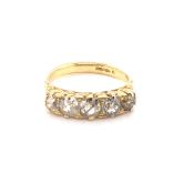 A FIVE STONE OLD CUT DIAMOND GRADUATED CARVED HALF HOOP RING IN A 9ct YELLOW GOLD HALLMARKED