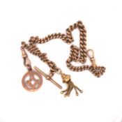 AN ANTIQUE 9ct OLD GOLD GRADUATED WATCH ALBERT CURB CHAIN WITH ATTACHED MASONIC CHARM, TASSEL AND