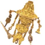 AN ANTIQUE GEORGIAN (LATE 18th / EARLY 19th C.) GILT METAL HEAVILY ENGRAVED CHATELAINE. THE BELT