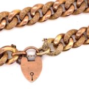 AN ANTIQUE 9ct OLD GOLD ENGRAVED CHARM BRACELET, COMPLETE WITH PADLOCK CLASP AND SAFETY CHAIN.