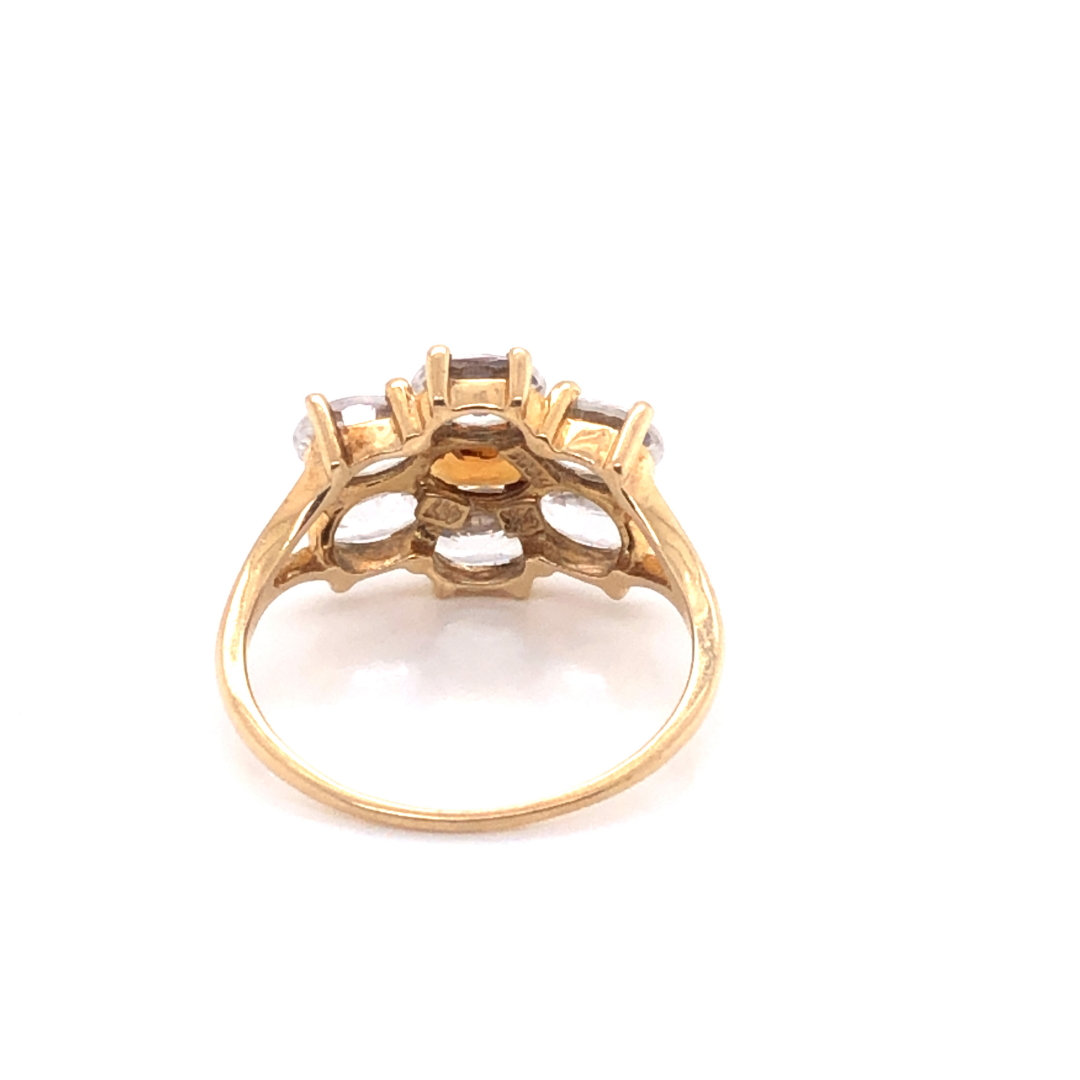 A MODERN 9ct GOLD DRESS RING, THE SEVEN GEMSTONES IN A HORIZONTAL CLAW SETTING. FINGER SIZE S. - Image 2 of 4