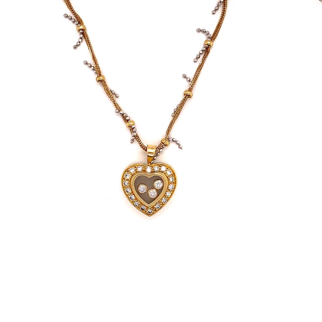 AN PRECIOUS YELLOW METAL AND DIAMOND FLOATING HEART PENDANT, ASSESSES AS 18CT FINENESS, SUSPENDED ON - Image 2 of 3