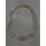 A VICTORIAN STERLING SILVER BOOK STYLE CHAIN WITH CANNONBALL DOUBLE EDGES AND TWO LARGE BOLT RING
