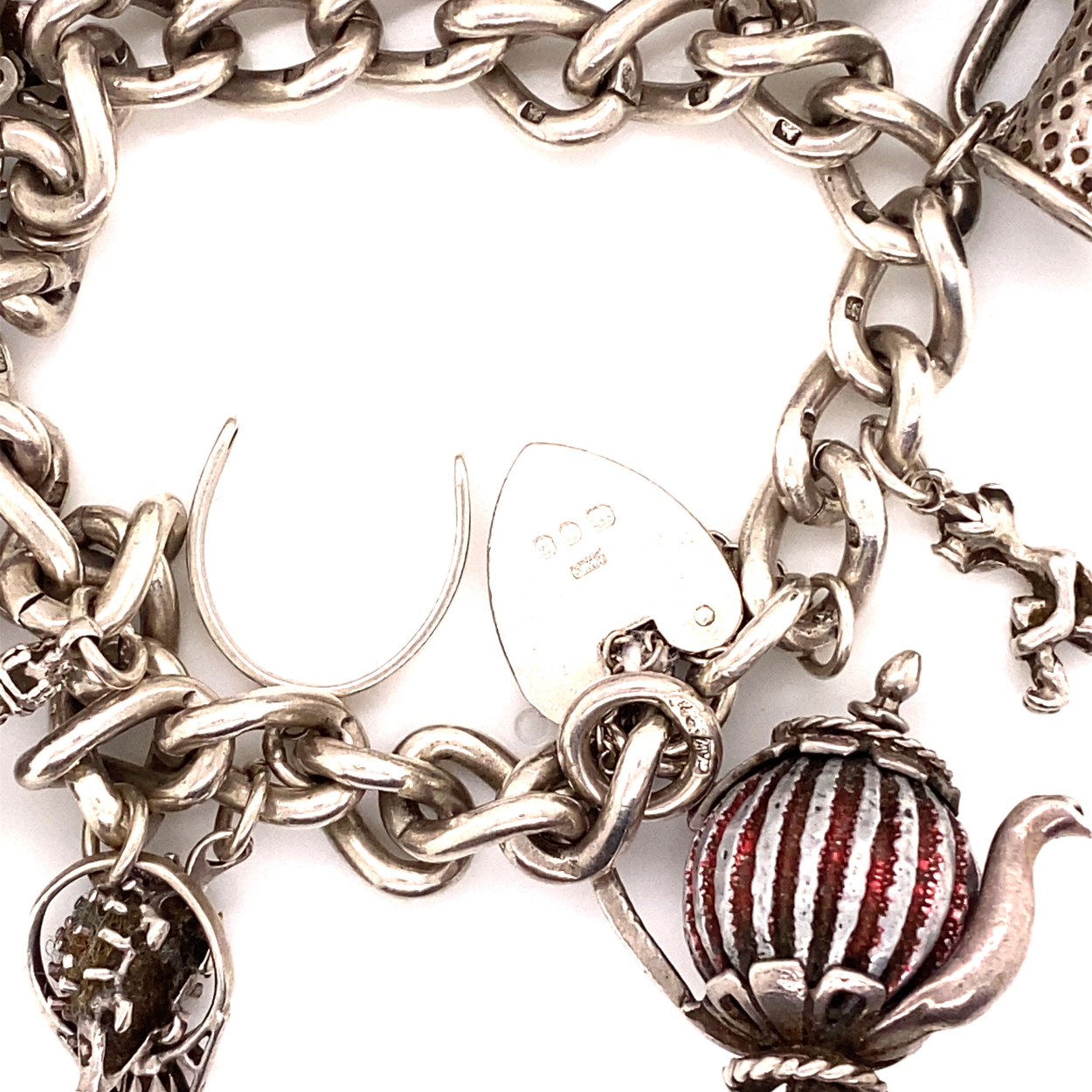 A HALLMARKED SILVER VINTAGE CHARM BRACELET, COMPLETE WITH AN ASSORTMENT OF SILVER CHARMS, AN - Image 2 of 2