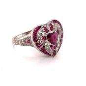 A RUBY, DIAMOND AND PRECIOUS WHITE METAL STAMPED PLAT AND ASSESSED AS 950 PLATINUM FINENESS ART DECO