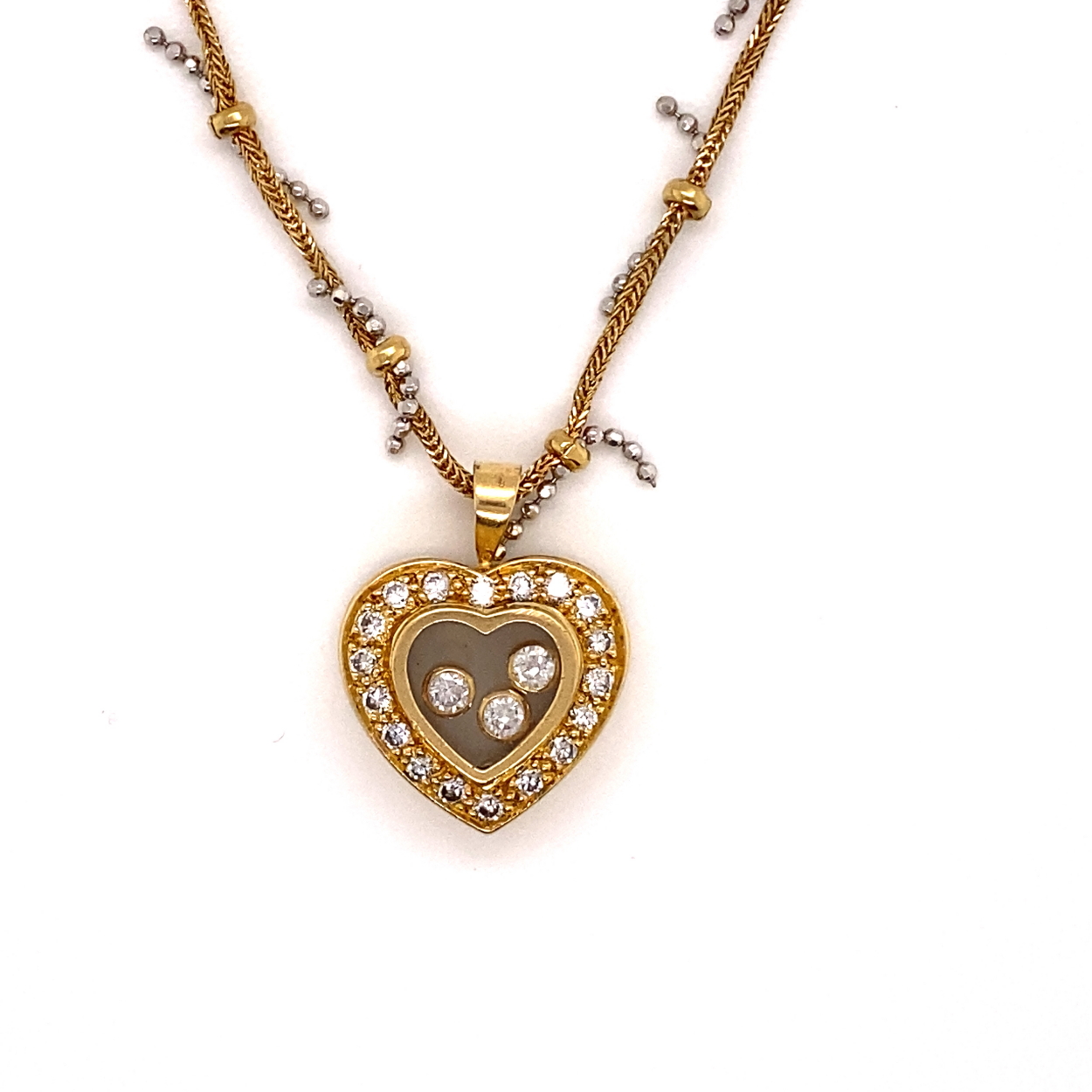 AN PRECIOUS YELLOW METAL AND DIAMOND FLOATING HEART PENDANT, ASSESSES AS 18CT FINENESS, SUSPENDED ON - Image 3 of 3