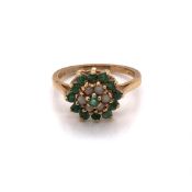 A VINTAGE 9ct YELLOW GOLD, OPAL AND DIAMOND CLUSTER RING, DATED 1975. FINGER SIZE L. WEIGHT 2.7grms.