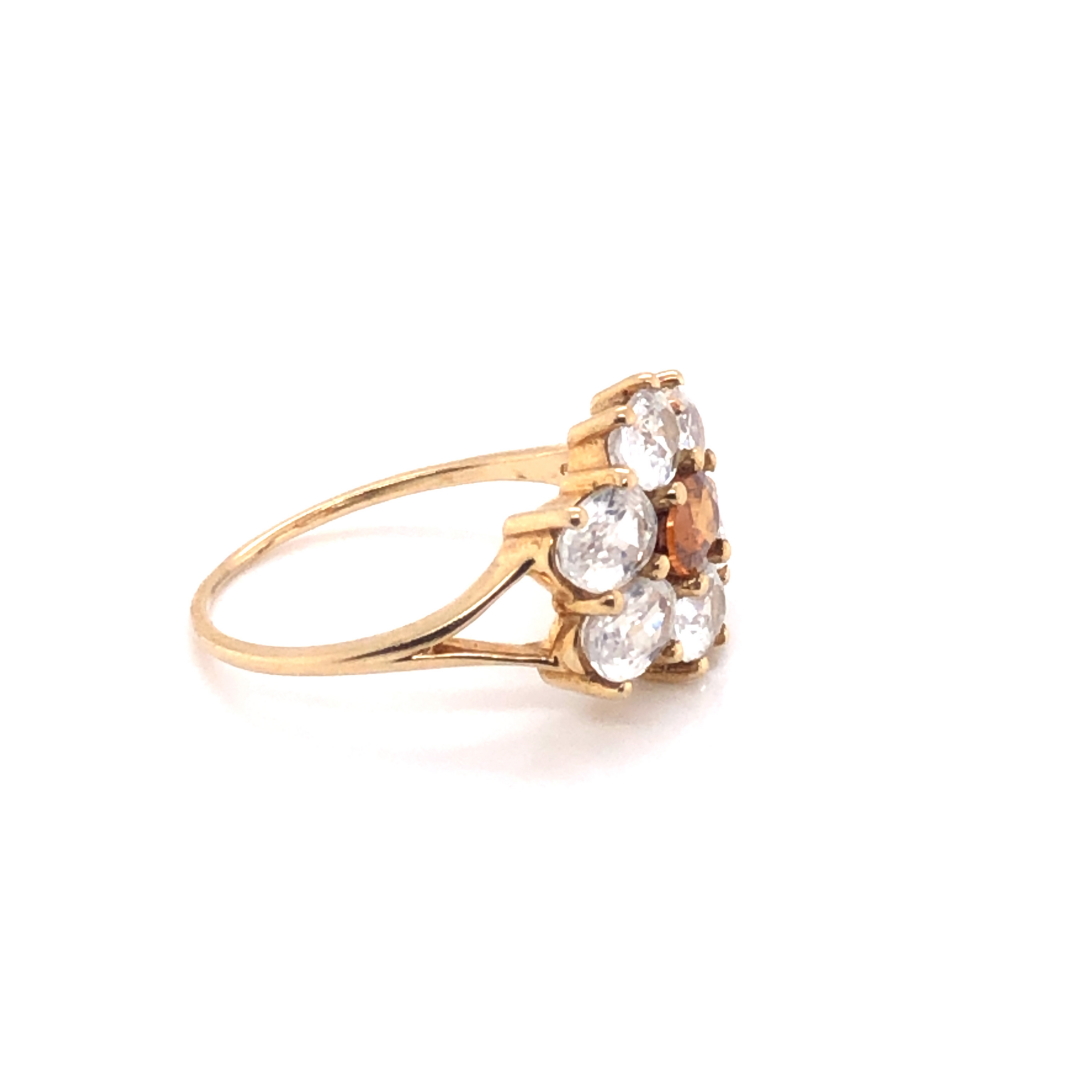 A MODERN 9ct GOLD DRESS RING, THE SEVEN GEMSTONES IN A HORIZONTAL CLAW SETTING. FINGER SIZE S. - Image 3 of 4