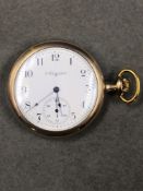 AN ELGIN OPEN FACED GOLD PLATED POCKET WATCH, ENGRAVED PHILADELPHIA WATCH CASE CO, WITH A SCREW DOWN