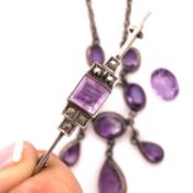 AN AMETHYST AND WHITE PRECIOUS METAL, TESTS AS STERLING SILVER, LAVALIER NECKLACE, AN ART DECO STYLE