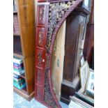 A CHINESE PIERCED AND CARVED RED LACQUER GROUND ARCH