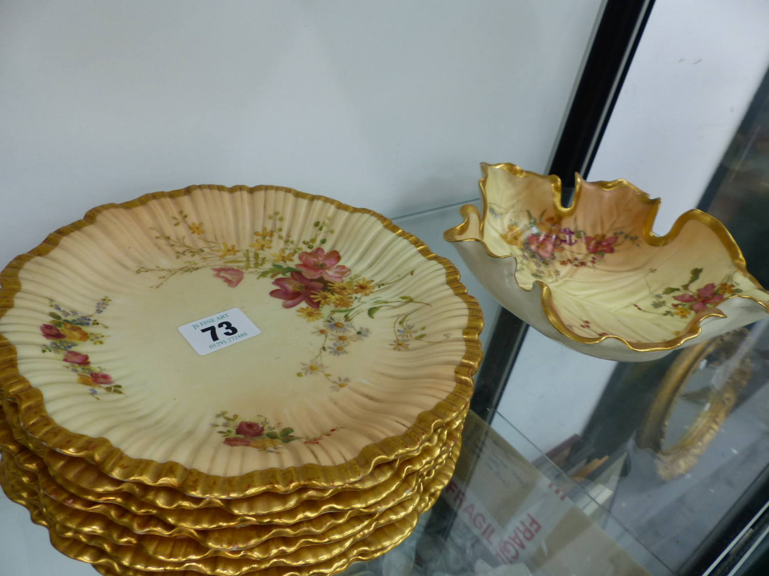A SET OF EIGHT ROYAL WORCESTER BLUSH IVORY FLORAL PAINTED SIDE PLATES AND A SIMILAR BOWL.