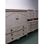 A CREAM PAINTED SUITE OF BEDSIDE CHESTS, A CHEST OF THREE DRAWERS AND A TELEVISION CABINET