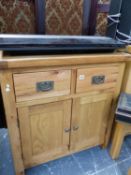 A SMALL OAK MODERN SIDE CABINET WITH TWO DRAWERS.