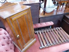 A MAHOGANY BEDSIDE CUPBOARD TOGETHER WITH A FOLDING LUGGAGE STAND