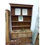 A SMALL RUSTIC PINE KITCHEN DRESSER W 126 X D 47 X H 228CMS.