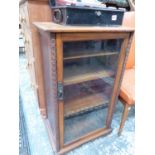 A GLAZED MAHOGANY MUSIC CABINET