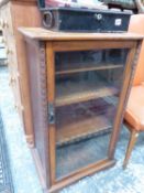 A GLAZED MAHOGANY MUSIC CABINET