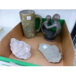 A CARVED SOAPSTONE MUG, A SMALL SOAPSTONE SCULPTURE, AND TWO FOSSIL INCLUDED STONES.