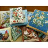 A GOOD COLLECTION OF HAND EMBROIDERED DECORATIVE CUSHIONS.