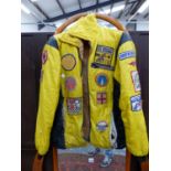 A VINTAGE SPEEDWAY JACKET WITH PATCHES, TWO CASTROL MARSHALLS ARM BANDS, A SIGNED MOTOR RACING