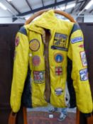A VINTAGE SPEEDWAY JACKET WITH PATCHES, TWO CASTROL MARSHALLS ARM BANDS, A SIGNED MOTOR RACING