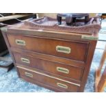 A BRASS MOUNTED CAMPAIGN CHEST OF THREE DRAWERS